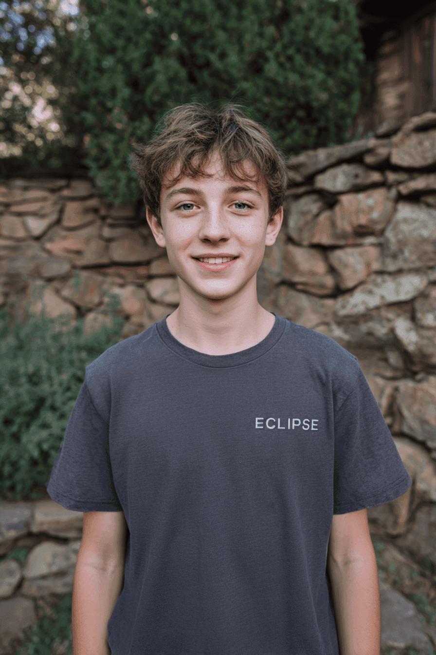 Two young boys looking at a tablet, representing K-12 students